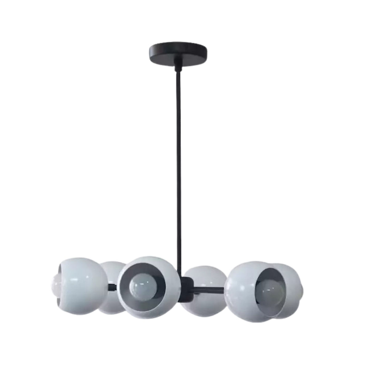 Marbella 6 light dome chandelier shown from the side with rounded white shades, exposed bulbs, and a streamlined black frame.