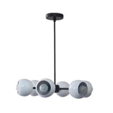 Marbella 6 light dome chandelier shown from the side with rounded white shades, exposed bulbs, and a streamlined black frame.