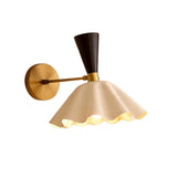 Marlow scalloped dome wall sconce illuminated with warm downward light and brass finish – Model 32826