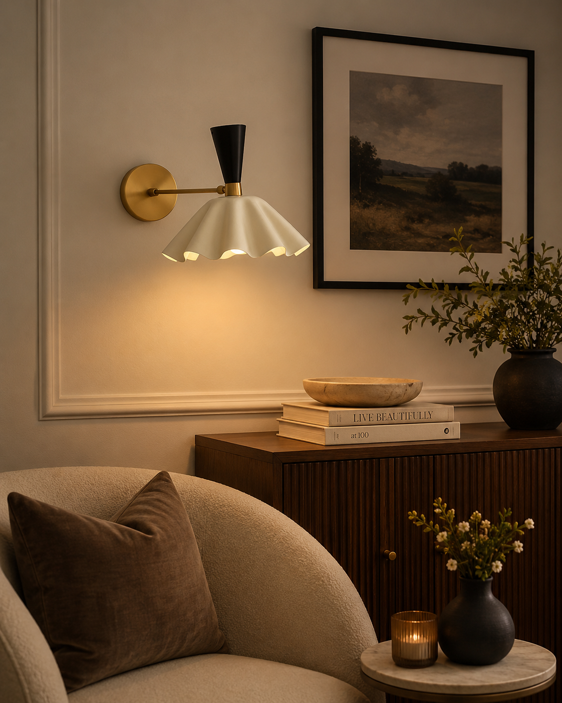 Marlow scalloped dome wall sconce with brass and black accents illuminated in a warm modern living room – Model 32826