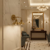 Marlow scalloped double wall sconce with two exposed warm bulbs and symmetrical brass shades shown from the front.