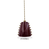 Dimension view of the Marlow 5-inch studded cone pendant light showing the glossy burgundy metal shade with decorative brass studs and adjustable hanging cord.