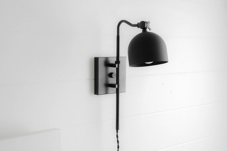 Matte black swing arm wall sconce with dome shade and adjustable arm, modern industrial wall lamp on square backplate