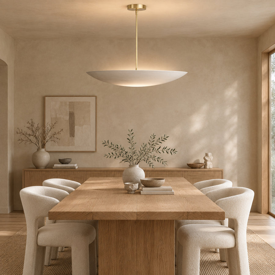Mayfair 5 light sculptural bowl chandelier featuring a wide off-white metal shade with slim brass-tone downrod and canopy.