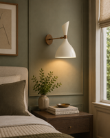 Milan Double Cone Wall Sconce with cream shade and brass finish styled beside a bedroom nightstand – Model 32835