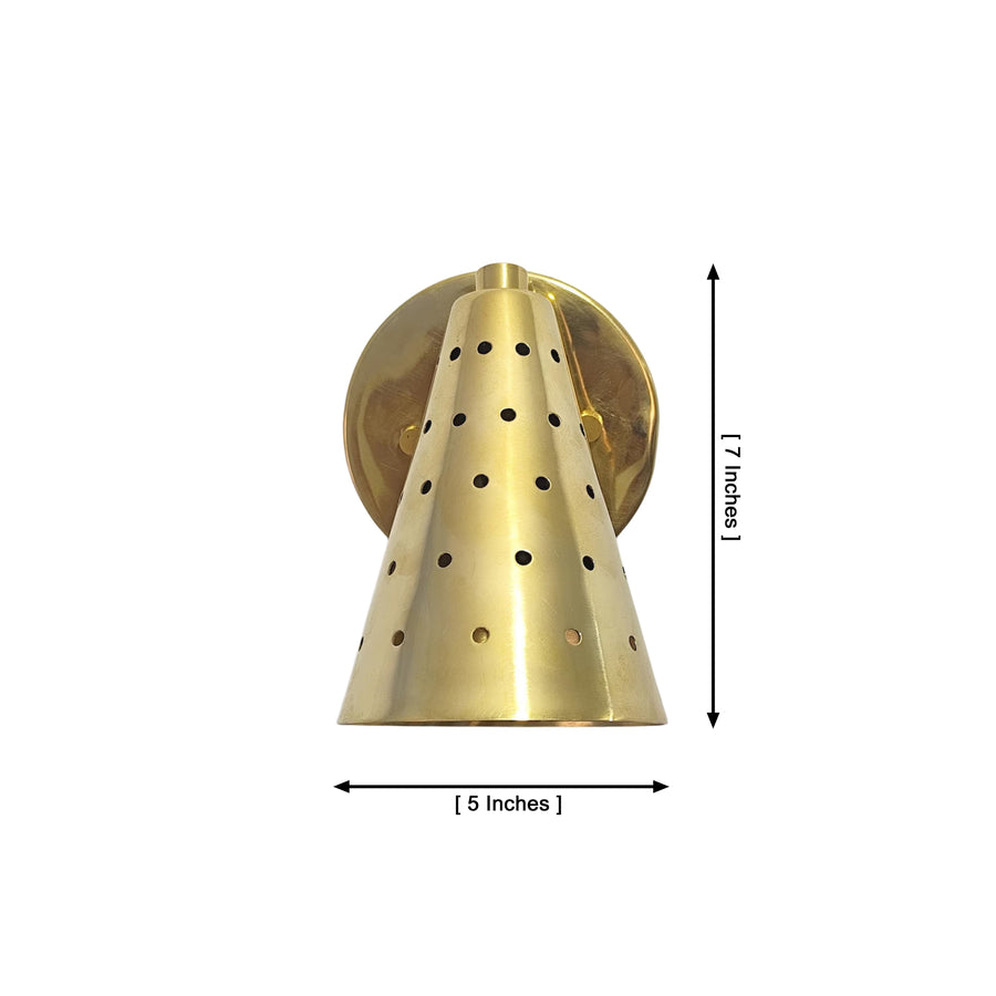Milan perforated brass cone wall sconce installed beside bed with warm ambient lighting – Model 32771