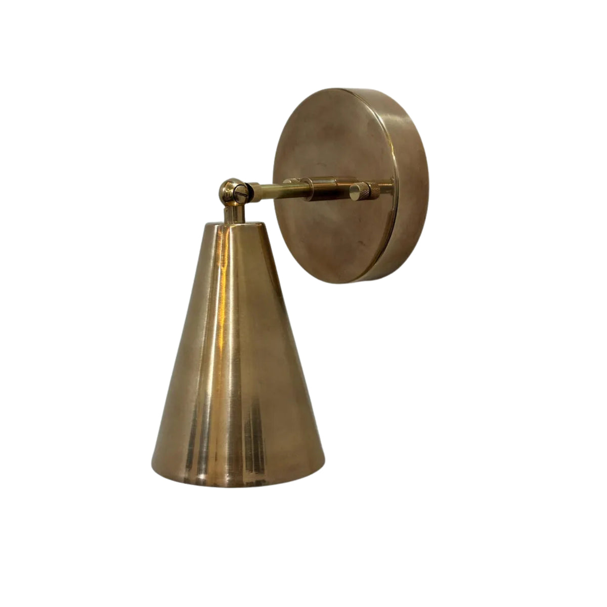 Three-quarter view of the Milan modern adjustable wall sconce in solid brass with a handcrafted tapered cone shade for bedside and hallway lighting.