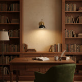 Milan brass adjustable wall sconce with dark dome shade and articulated swing arm, side view