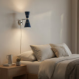 Front view of Milan blue double cone wall sconce with polished metal accents and adjustable swing arm.
