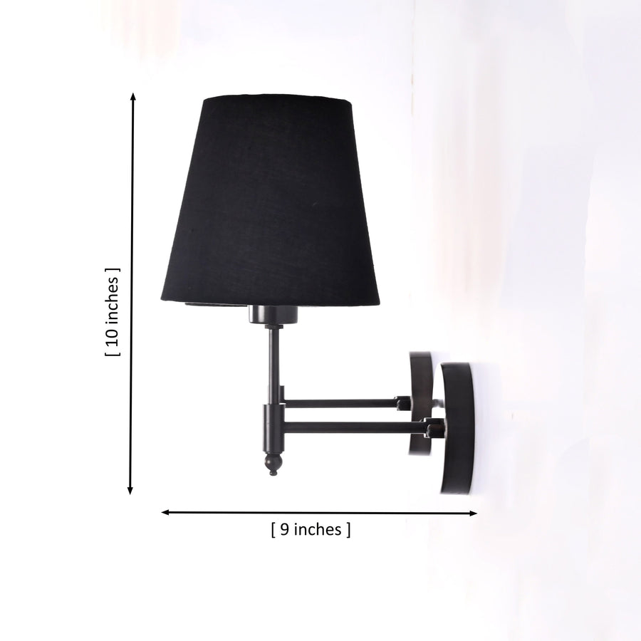 Lifestyle room view of Milan black shade wall sconces installed above classic armchairs with warm ambient lighting.
