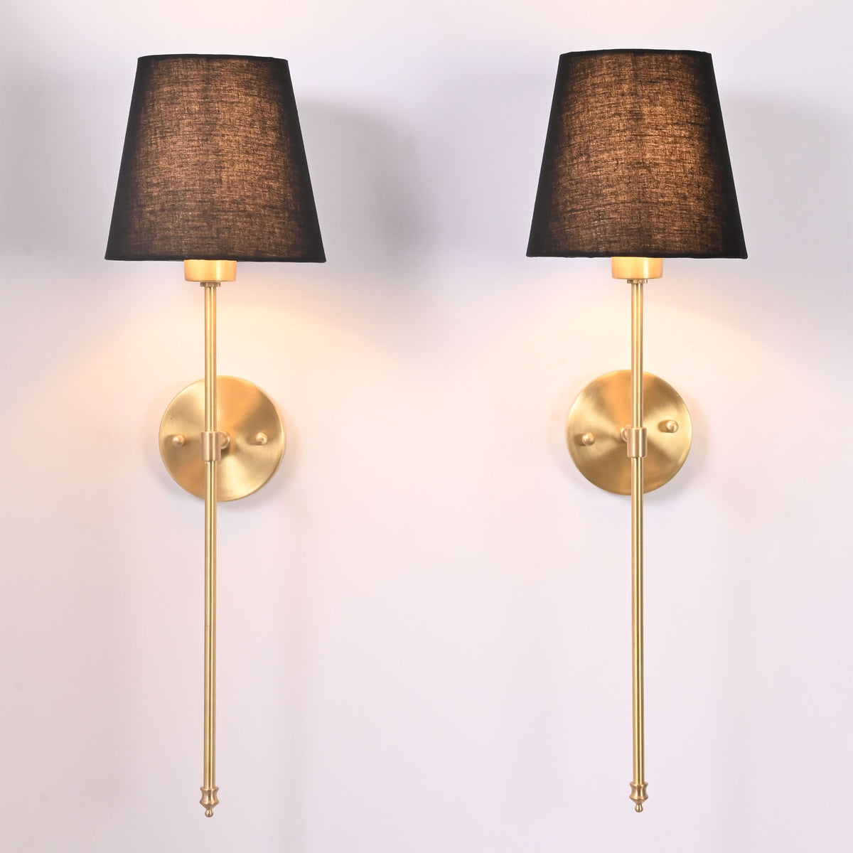 Pair of Milan black shade rod wall sconces with tall slim frames and round backplates.