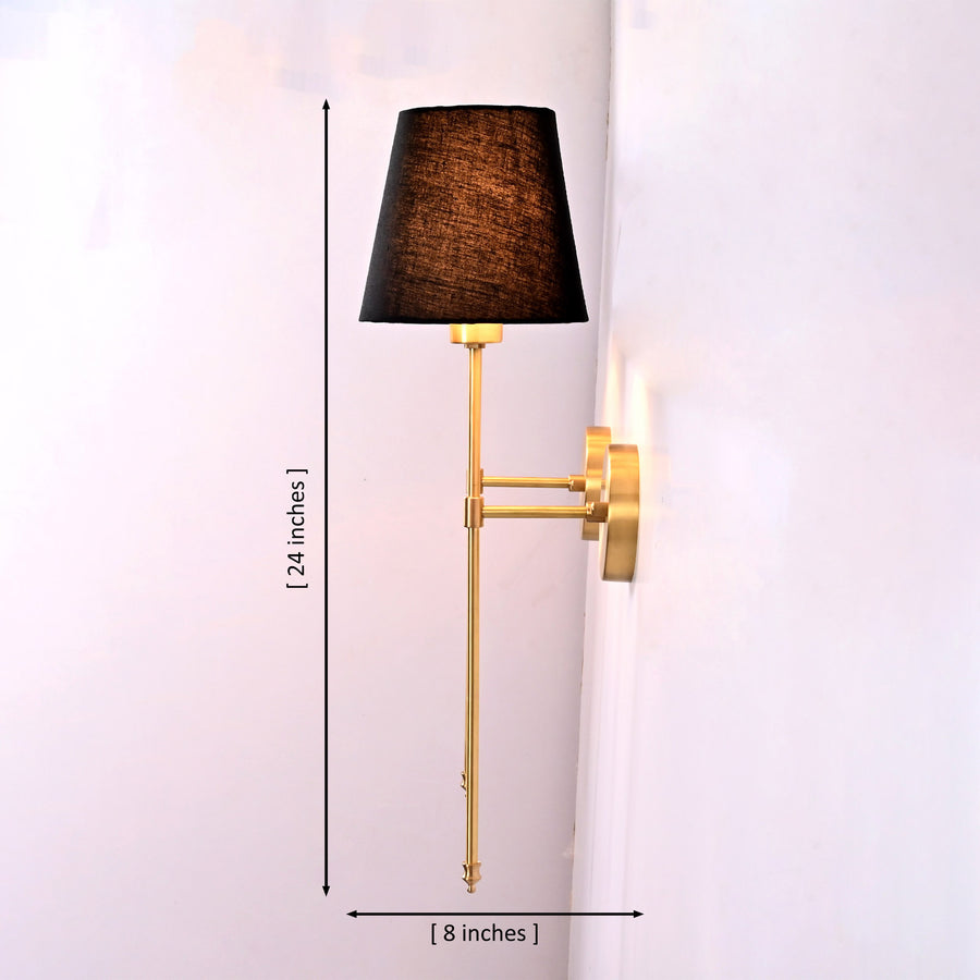 Milan black shade wall sconces installed beside framed artwork above sofa in a warm classic living room.