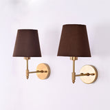 Side angle of Milan Brown Shade Antique Brass Short Wall Sconce showing 9-inch projection and antique brass arm.