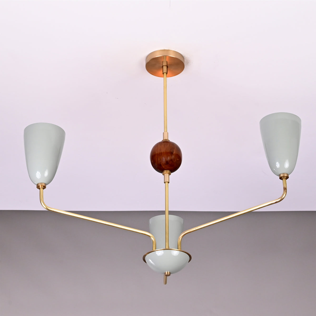 Front view of Milan Cone Arm Chandelier with three cone shades, curved arms, and central decorative sphere.