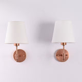 Front view of the Milan copper antique solid brass wall sconce with a white tapered fabric shade, featuring a handcrafted modern wall light for bedrooms, hallways, living rooms, and luxury interiors.
