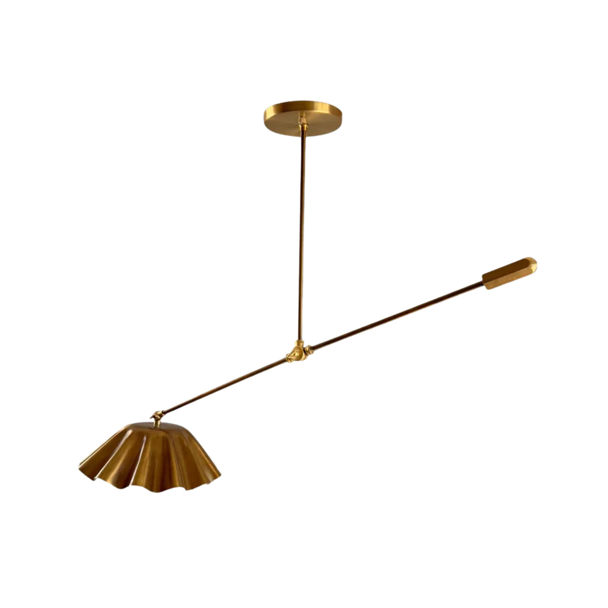 Side view of Milan 1-light counterbalance pendant featuring a sculptural brass arm and fluted metal dome shade.