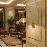 Milan 1 light curved arm cone wall sconce with neutral shade and warm brass finish