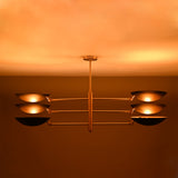 Milan Disc Linear Chandelier installed on ceiling with six black disc shades and warm upward glow.
