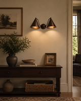 Milan 2-light double cone wall sconce installed above a console table in a warm traditional interior – Model 32755