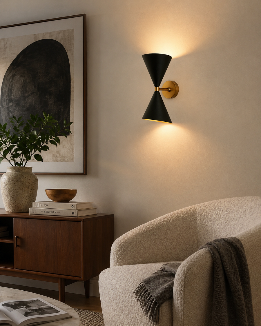Milan double cone wall sconce with warm up and down lighting installed in a modern living room