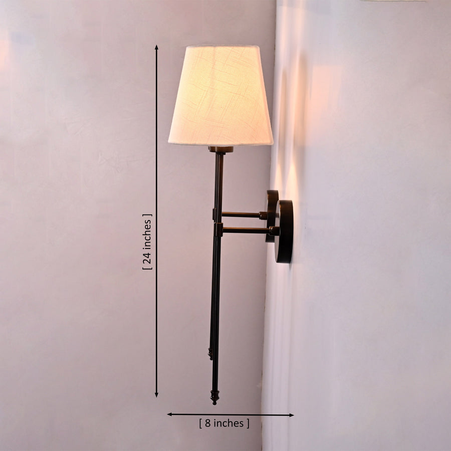 Milan ivory shade black wall sconces installed beside framed artwork in a warm classic living room.
