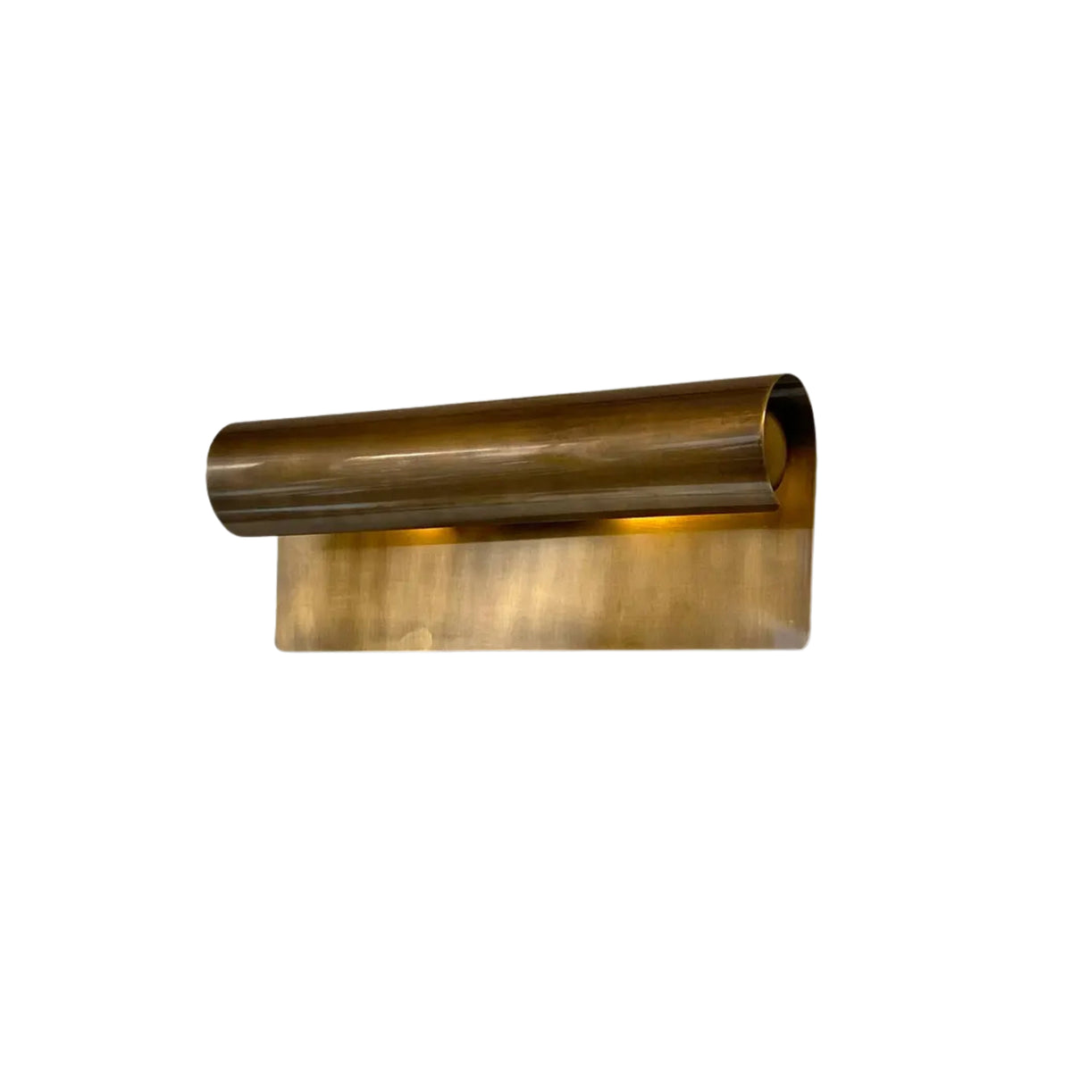 Angled view of the Milan Modern Picture Light showcasing its handcrafted cylindrical brass shade and contemporary architectural profile.