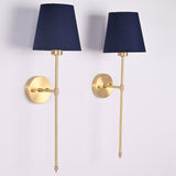 Angled view of Milan navy shade rod wall sconces with golden frame and classic round backplate.