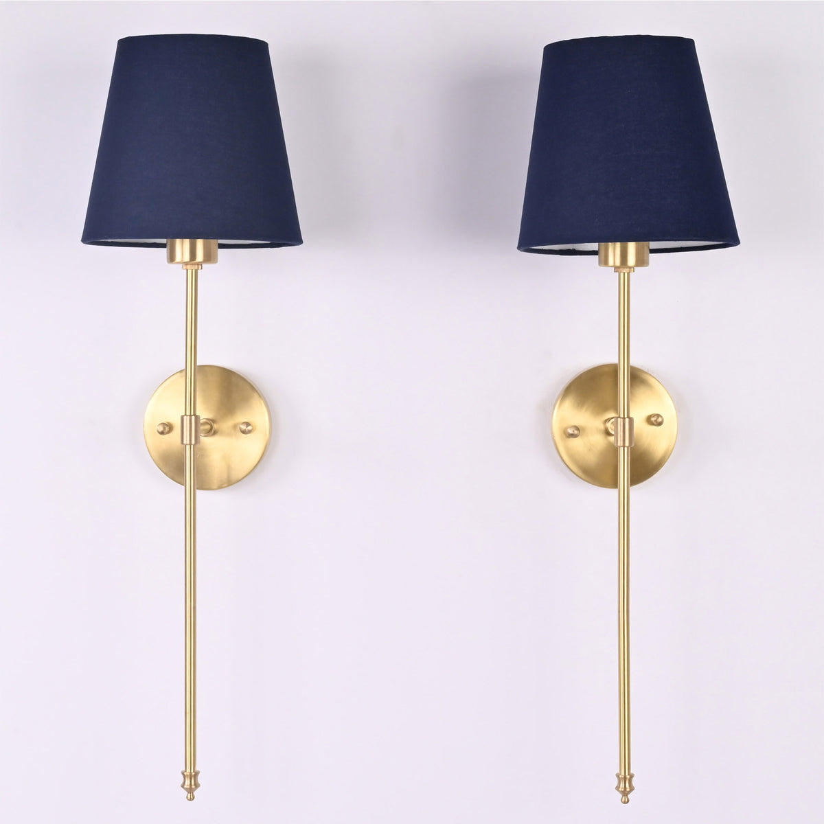 Pair of Milan navy shade rod wall sconces with slim vertical frames and round wall backplates.