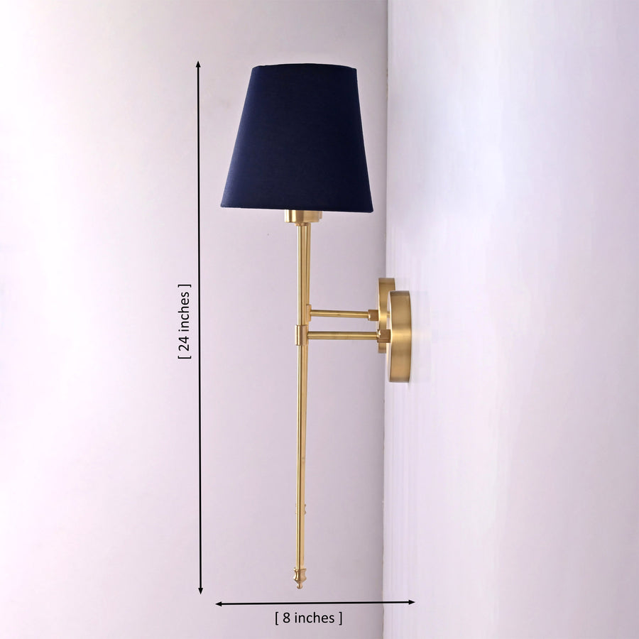 Milan navy shade wall sconces installed beside framed artwork above sofa in a warm classic living room.