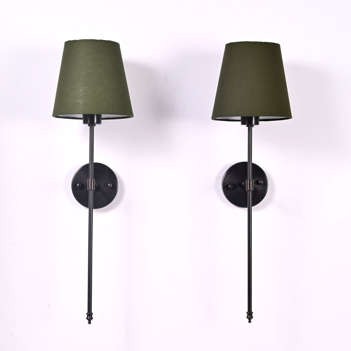 Pair of Milan olive shade black rod wall sconces with slim vertical frames and round backplates.