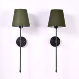 Pair of Milan olive shade black rod wall sconces with slim vertical frames and round backplates.