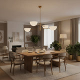 Straight product view of Milan 4-light chandelier with white opal bowl shades, brass frame, and ceiling downrod.