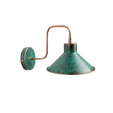 Angled view of Milan green patina wall sconce with wide cone shade and curved copper arm – Model 32780