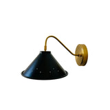 Angled product view of Milan wall sconce with black perforated cone shade and elegant curved brass arm.