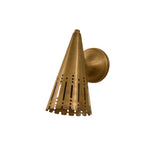 Angled view of Milan perforated cone wall sconce featuring tapered aged brass shade and round wall canopy.