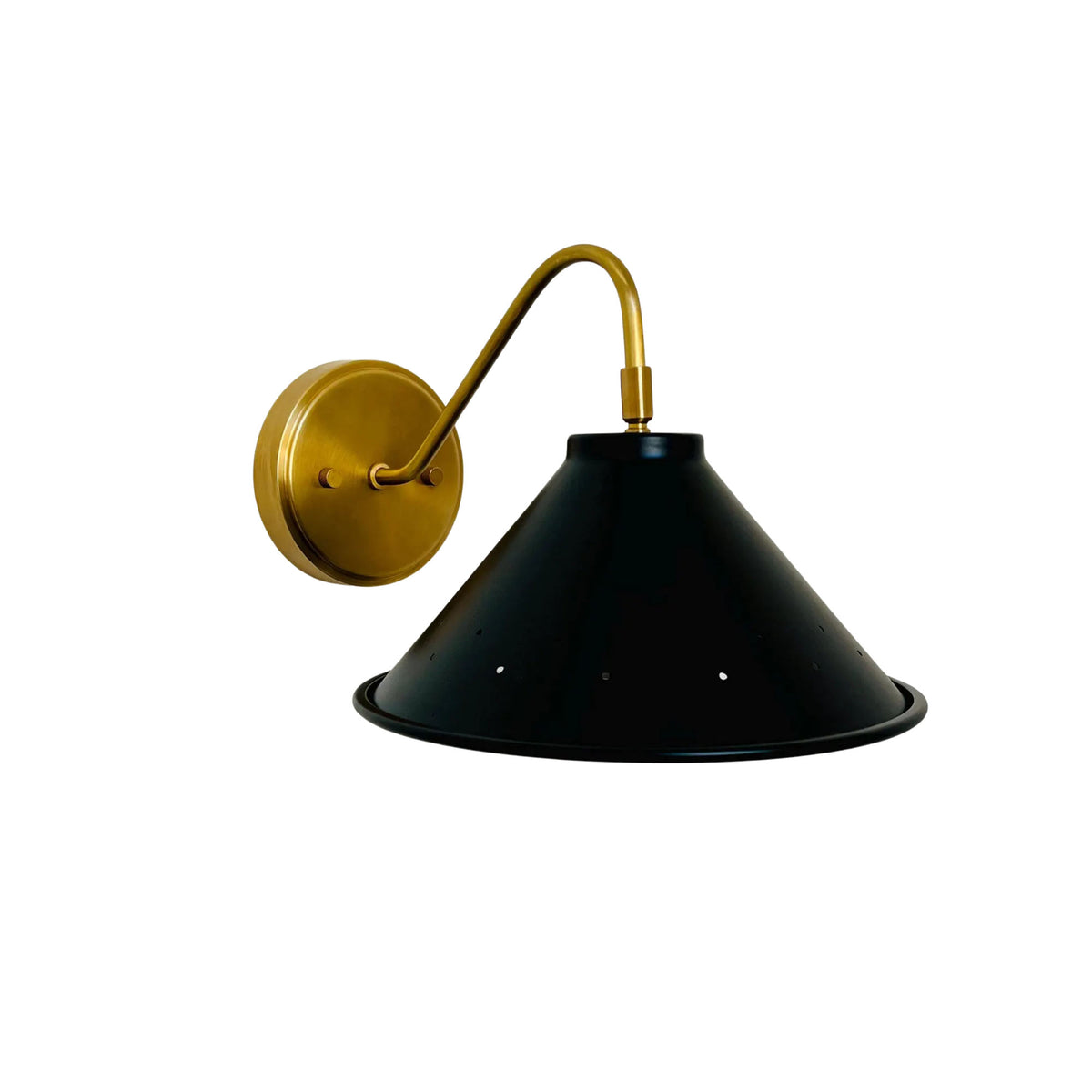 Milan perforated cone wall sconce with black metal shade, curved brass arm and round brass wall canopy.