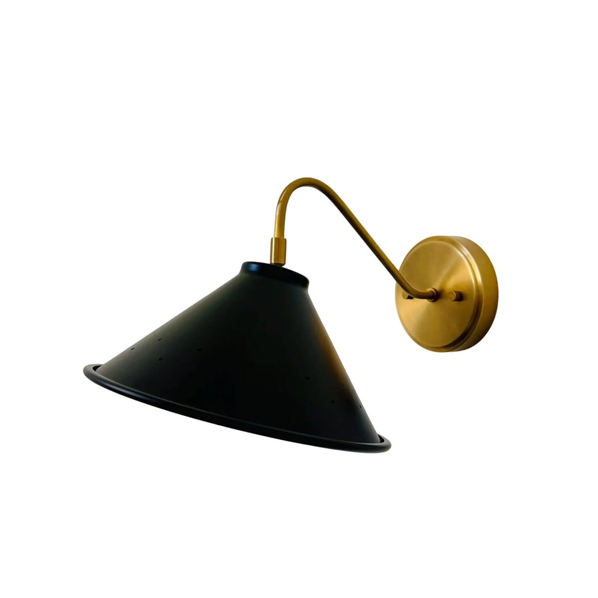 Reverse angled view of Milan black cone wall sconce with perforated shade and brass wall mount.