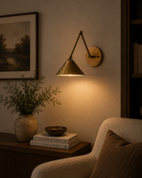 Milan pleated cone swing arm wall sconce installed in a cozy living room reading corner with warm ambient lighting – Model 32810