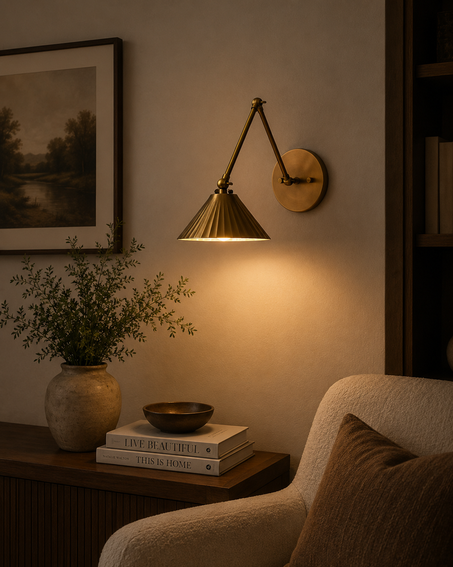 Milan pleated cone swing arm wall sconce installed in a cozy living room reading corner with warm ambient lighting – Model 32810