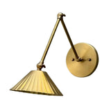 Side view of Milan adjustable brass wall sconce featuring articulated arms and fluted cone shade – Model 32810
