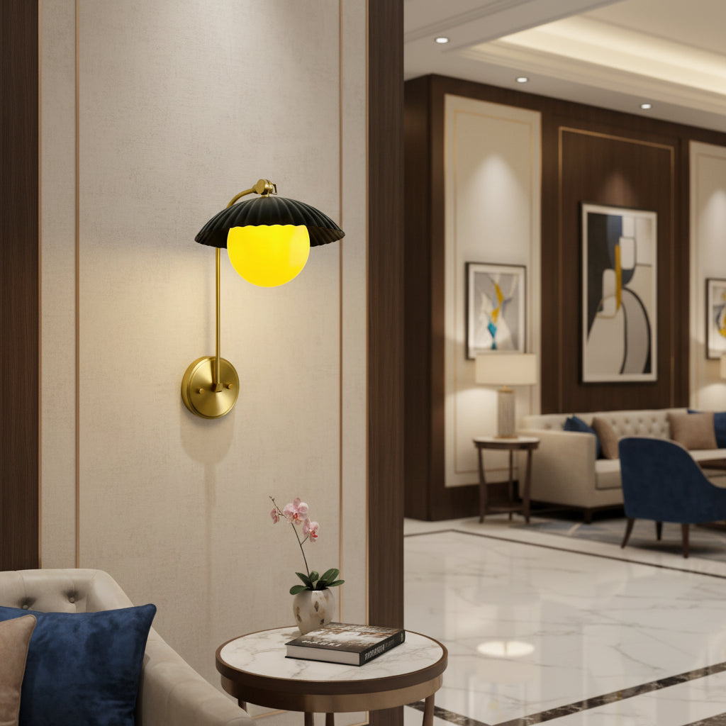 Milan ribbed black dome wall sconce with illuminated frosted glass globe and brass arm, Model 32788.