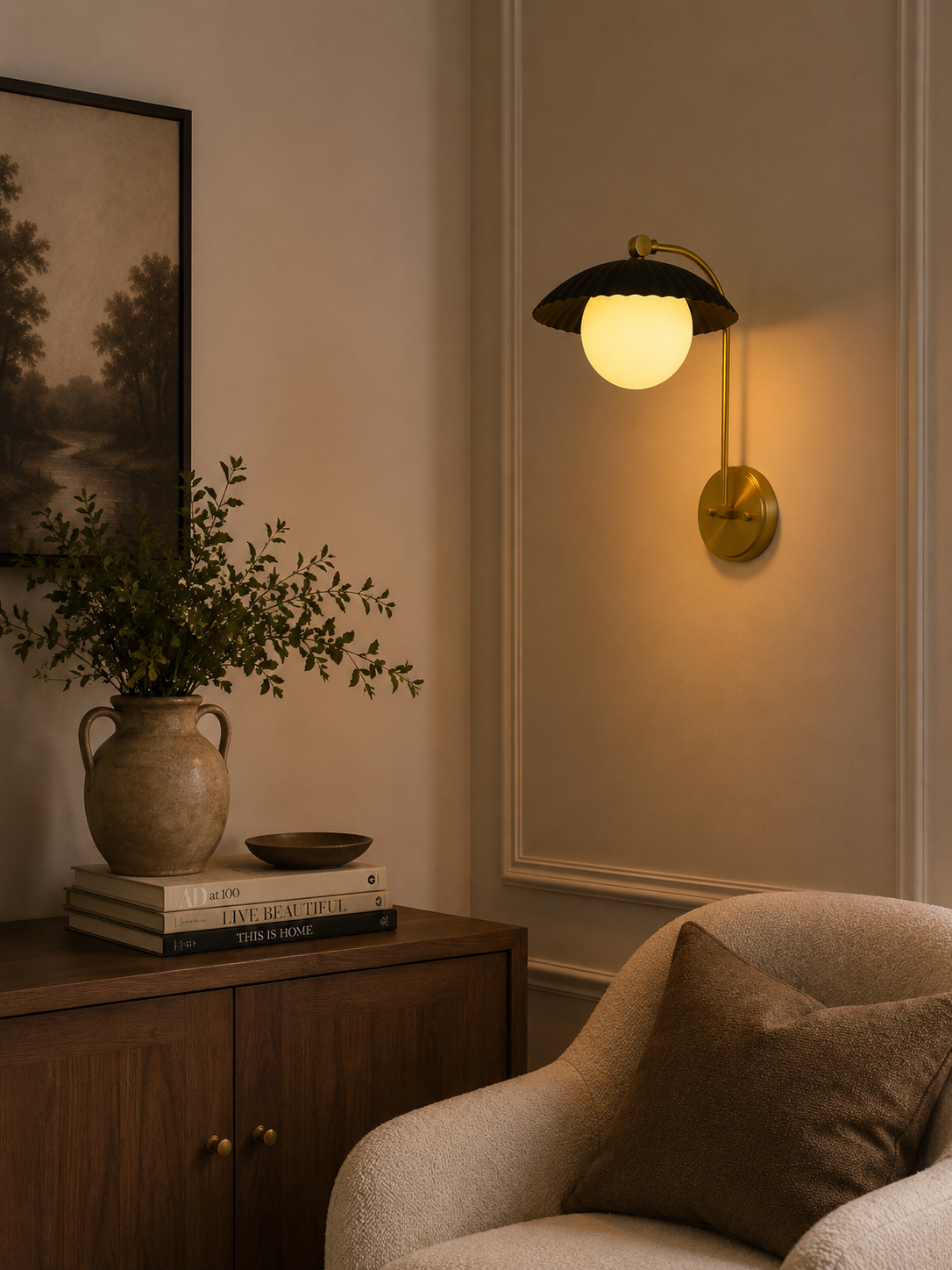 Milan ribbed dome globe wall sconce installed in a warm modern living room with brass and black finish.