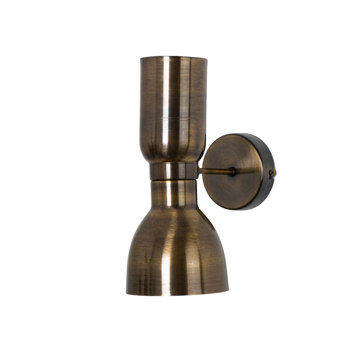 Milan 2-light hourglass wall sconce in antique brass finish with round wall canopy and sculptural metal shades, angled view.