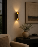Milan brass up and down wall sconce installed in a warm modern living room interior – Model 32807