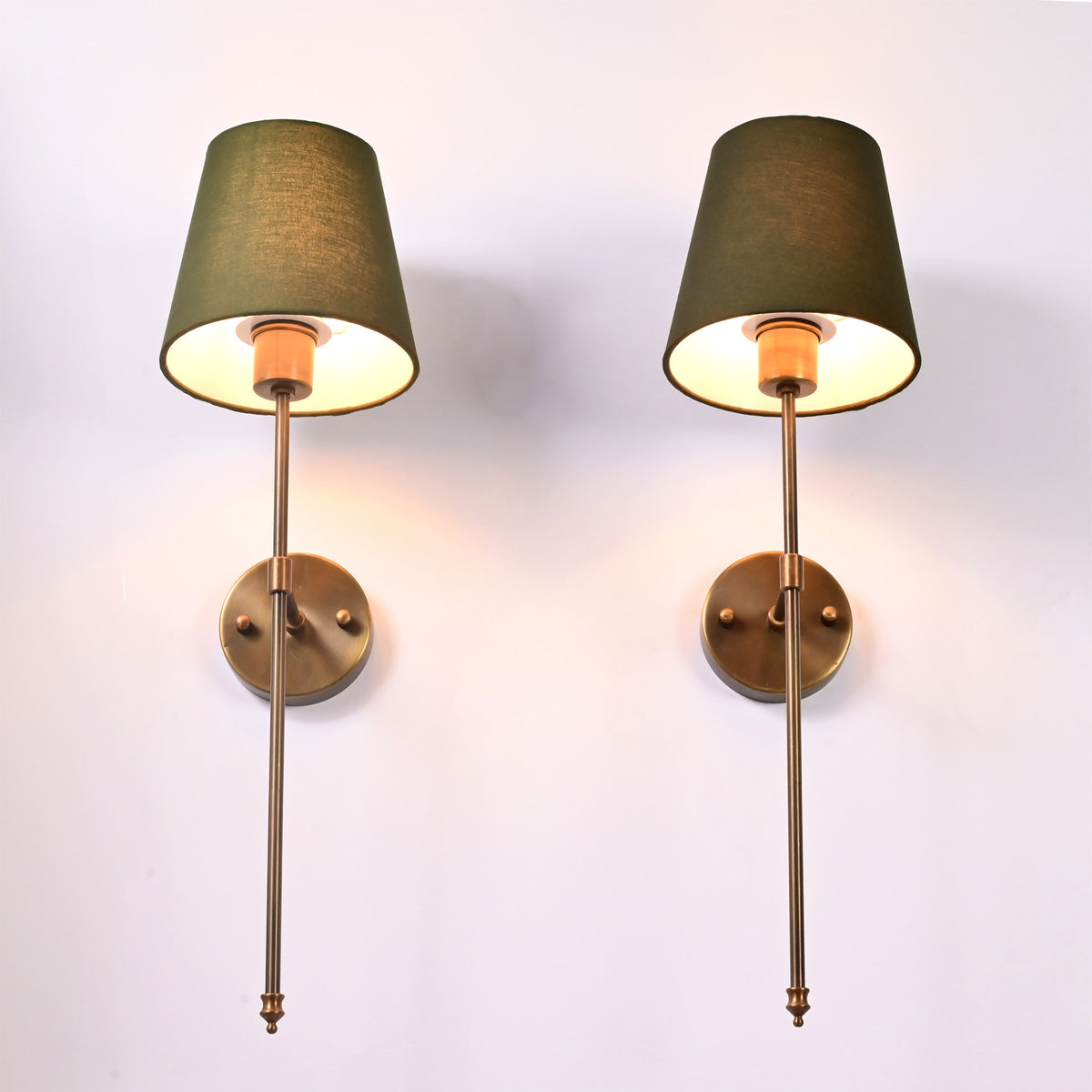 Close up of Milan Shade Rod Wall Sconce showing tapered fabric shade, warm light, and slim vertical rod.