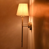 Side view of Milan Shade Rod Wall Sconce highlighting slim wall projection, fabric shade, and warm ambient glow.