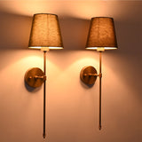 Side view of Milan Shade Rod Wall Sconce pair with slim projecting arms and warm fabric shade glow.