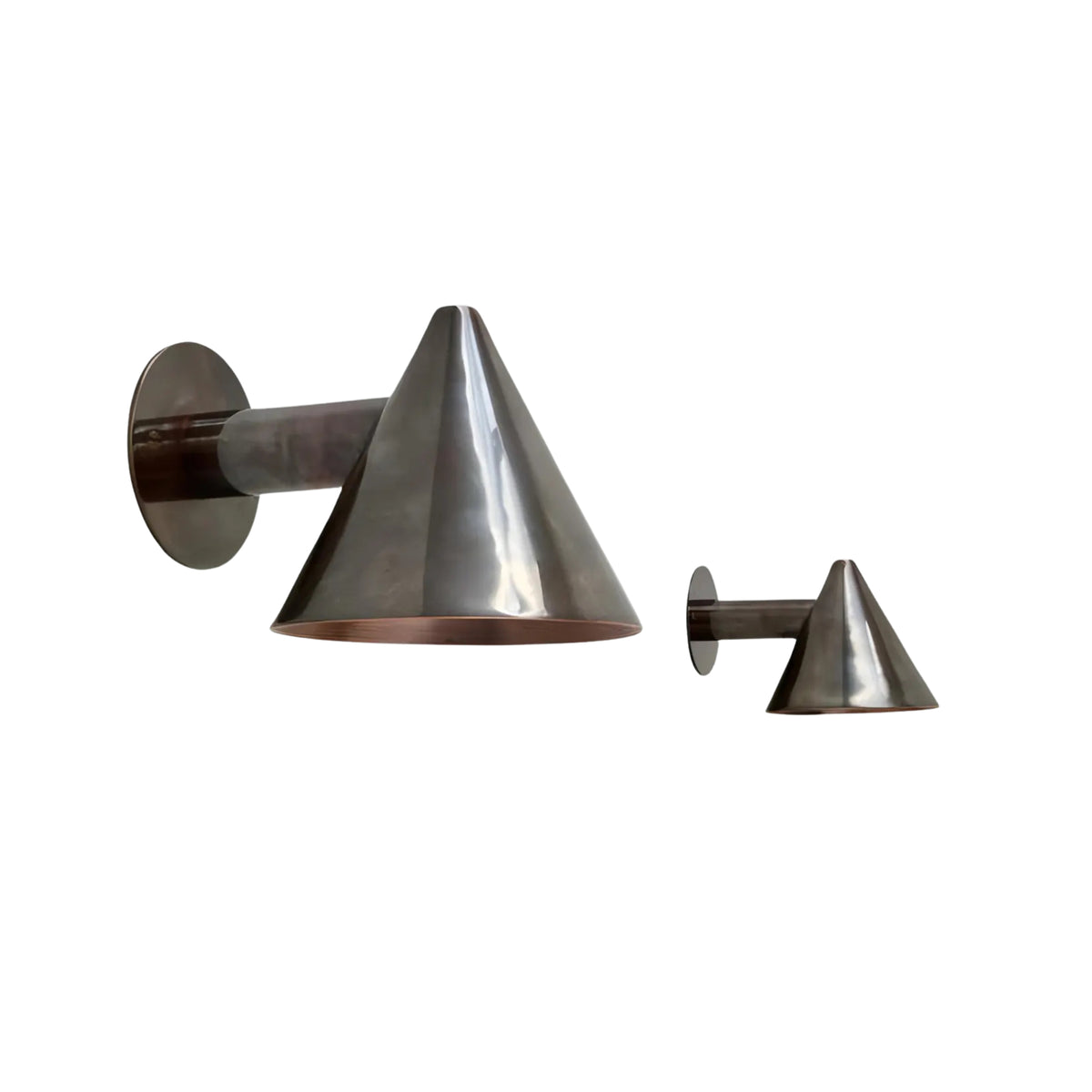 Front perspective view of the Milan Tapered Cone Wall Sconce featuring a handcrafted tapered metal cone shade with a warm copper interior and cylindrical wall arm.