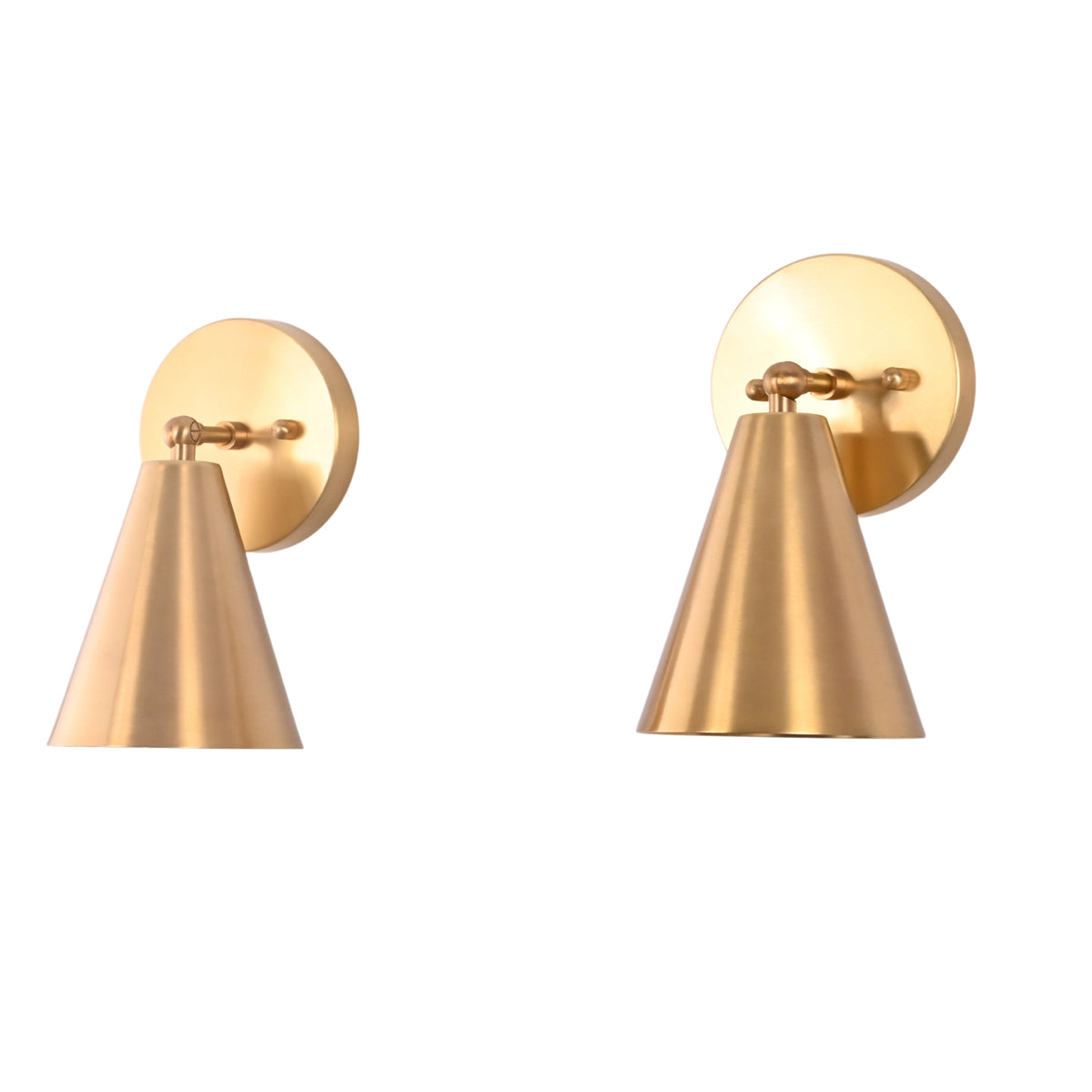 Angled view of the Milan Tapered Cone Wall Sconce Set of 2 showcasing handcrafted brass cone shades and circular wall mounts with minimalist contemporary styling.