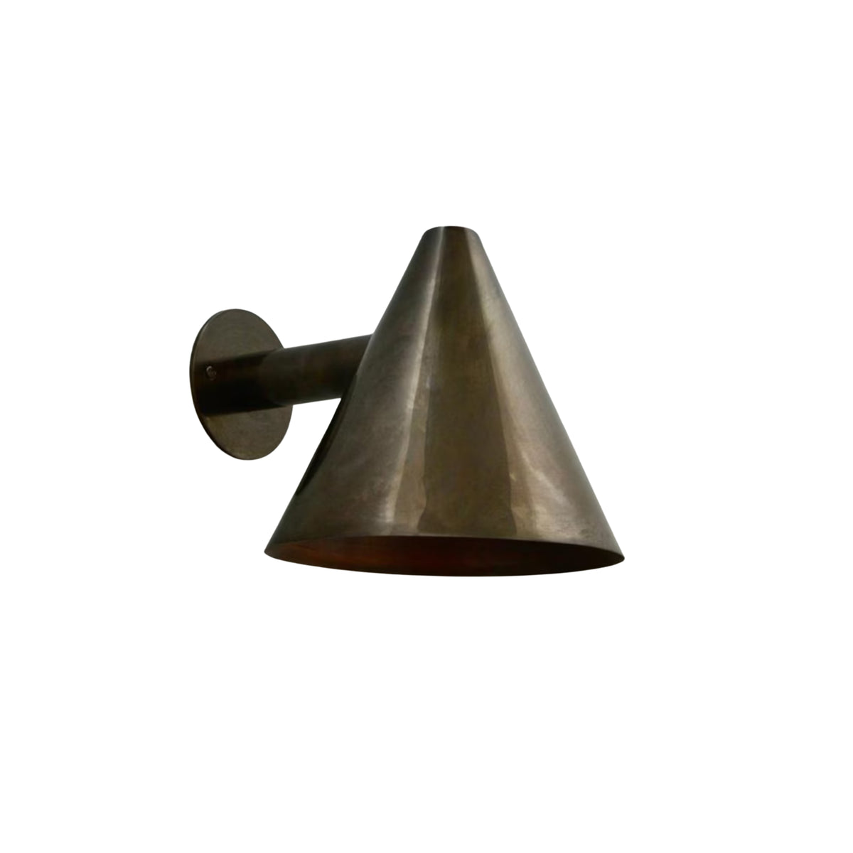 Side perspective of the Milan handcrafted cone wall sconce featuring a minimalist silhouette with solid brass construction and warm metallic interior.
